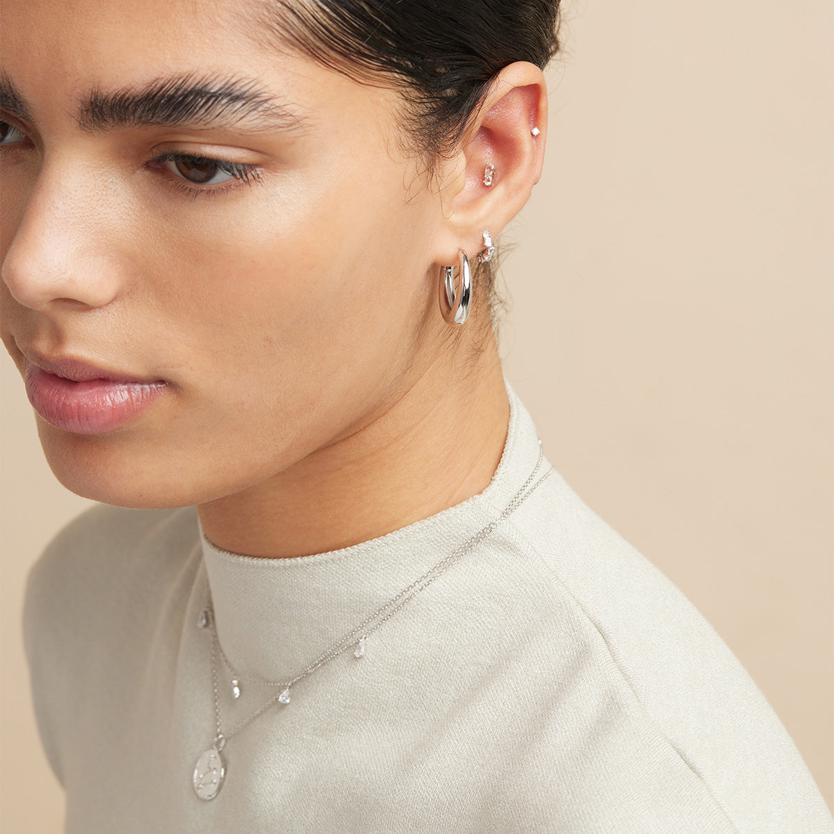 Crystal Pear Huggies in Silver