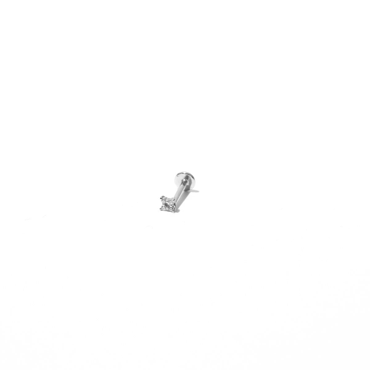 Cosmic Star Crystal Piercing Stud in Solid White Gold flat lay shot