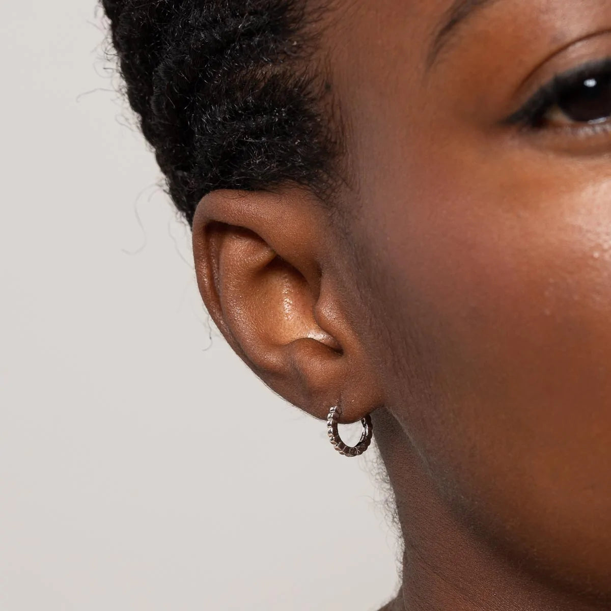 Heart Pave Charm Huggies in Silver worn without charm