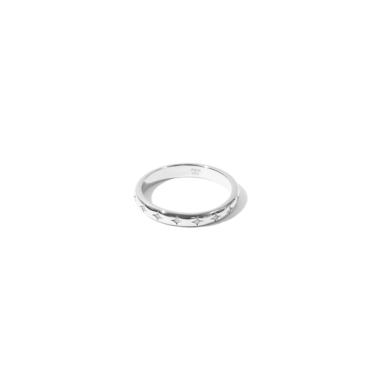 Cosmic Star Band Ring in Silver flat lay shot