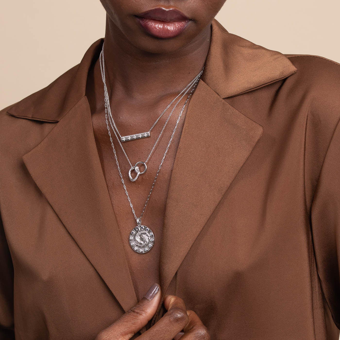 Pisces Bold Zodiac Pendant Necklace in Silver worn layered with necklaces