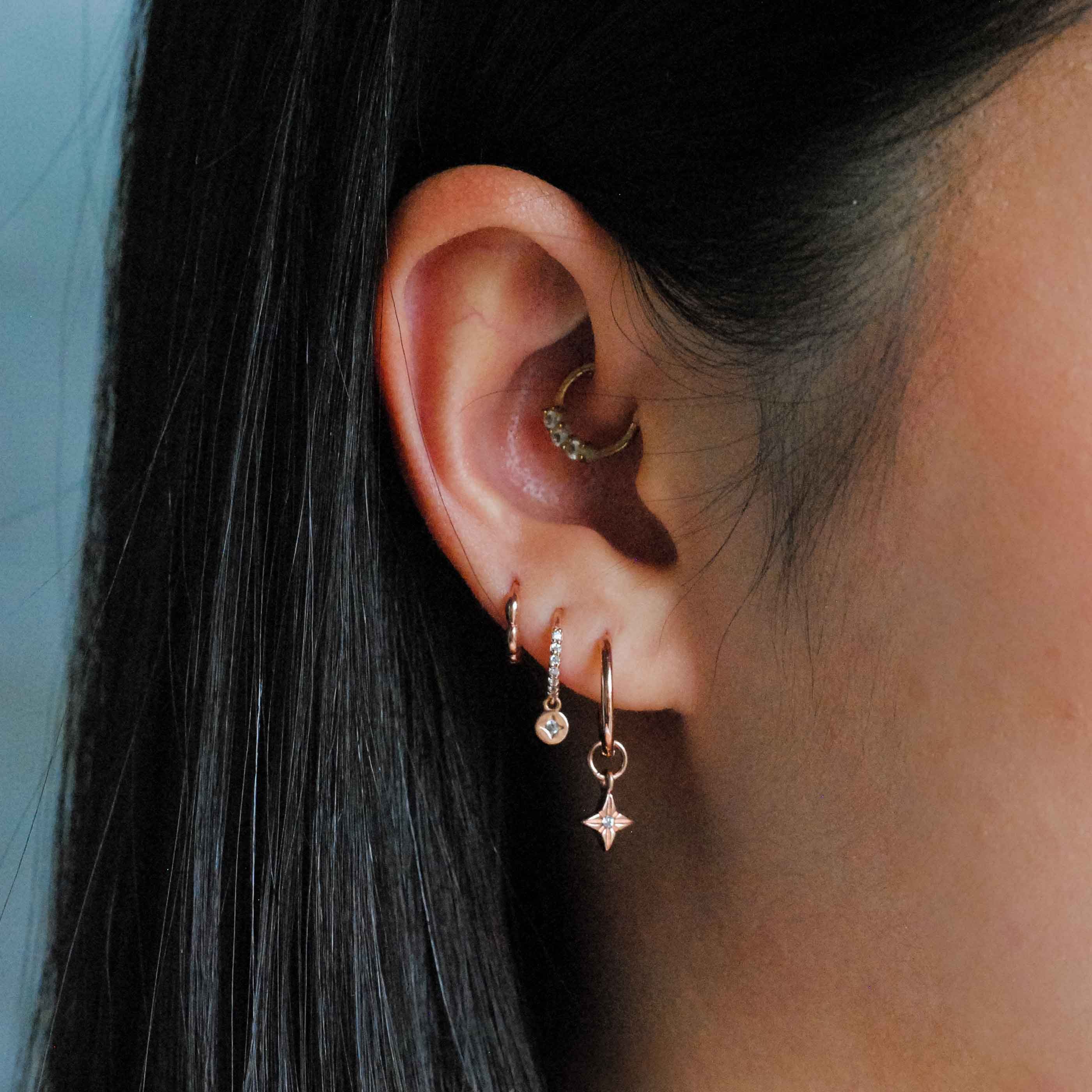 Bubble Clicker in Rose Gold worn in third lobe piercing