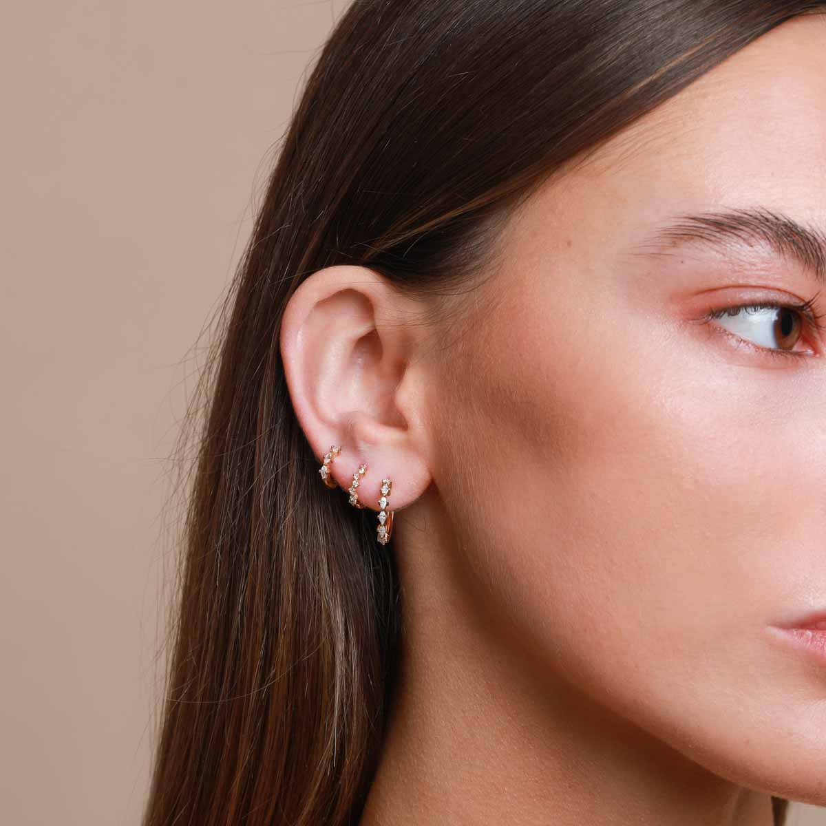 Worn shot of Worn shot of Cluster Hoop 8mm in Gold in upper lobe