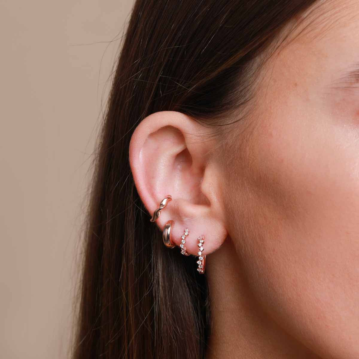 Worn shot of Cluster Hoop 8mm in Rose Gold in upper lobe
