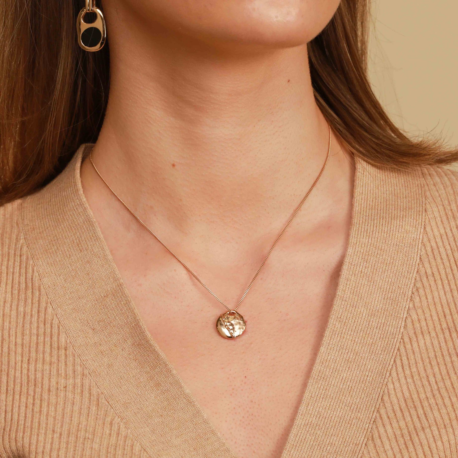 Worn shot of Molten Coin Pendant Necklace in Gold
