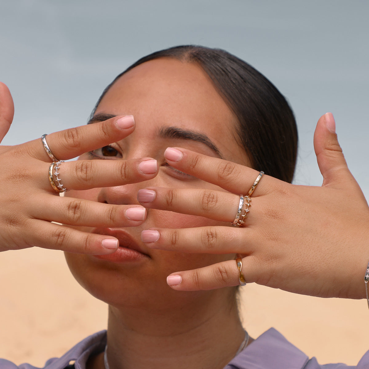 Cosmic Star Band Rings in Silver and Gold worn stacked with Cosmic Star Stacking Rings in Gold and Silver