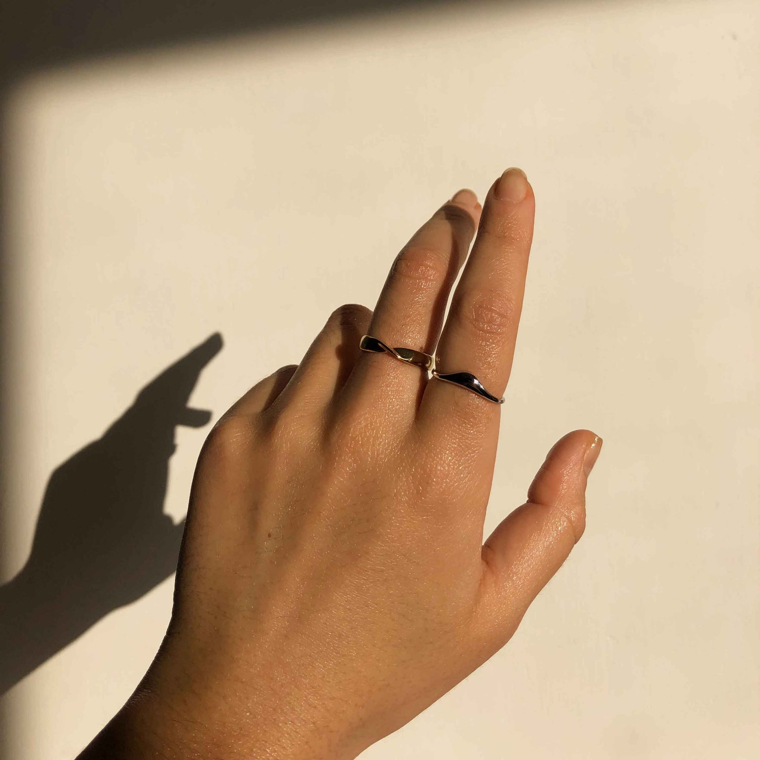 Elemental Ring in Gold worn with molten ring in silver