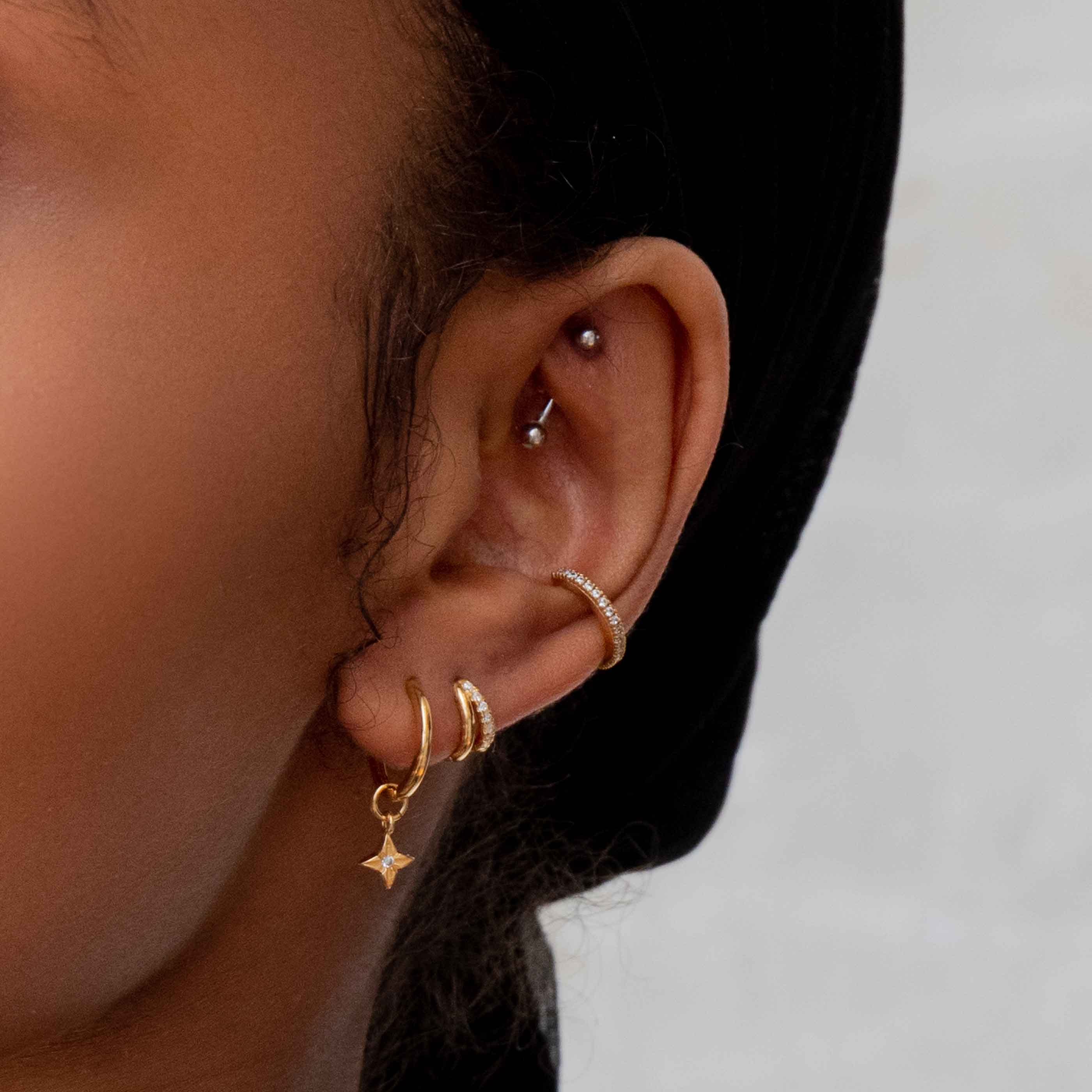 Illusion Crystal Clicker in Gold worn in second lobe piercing