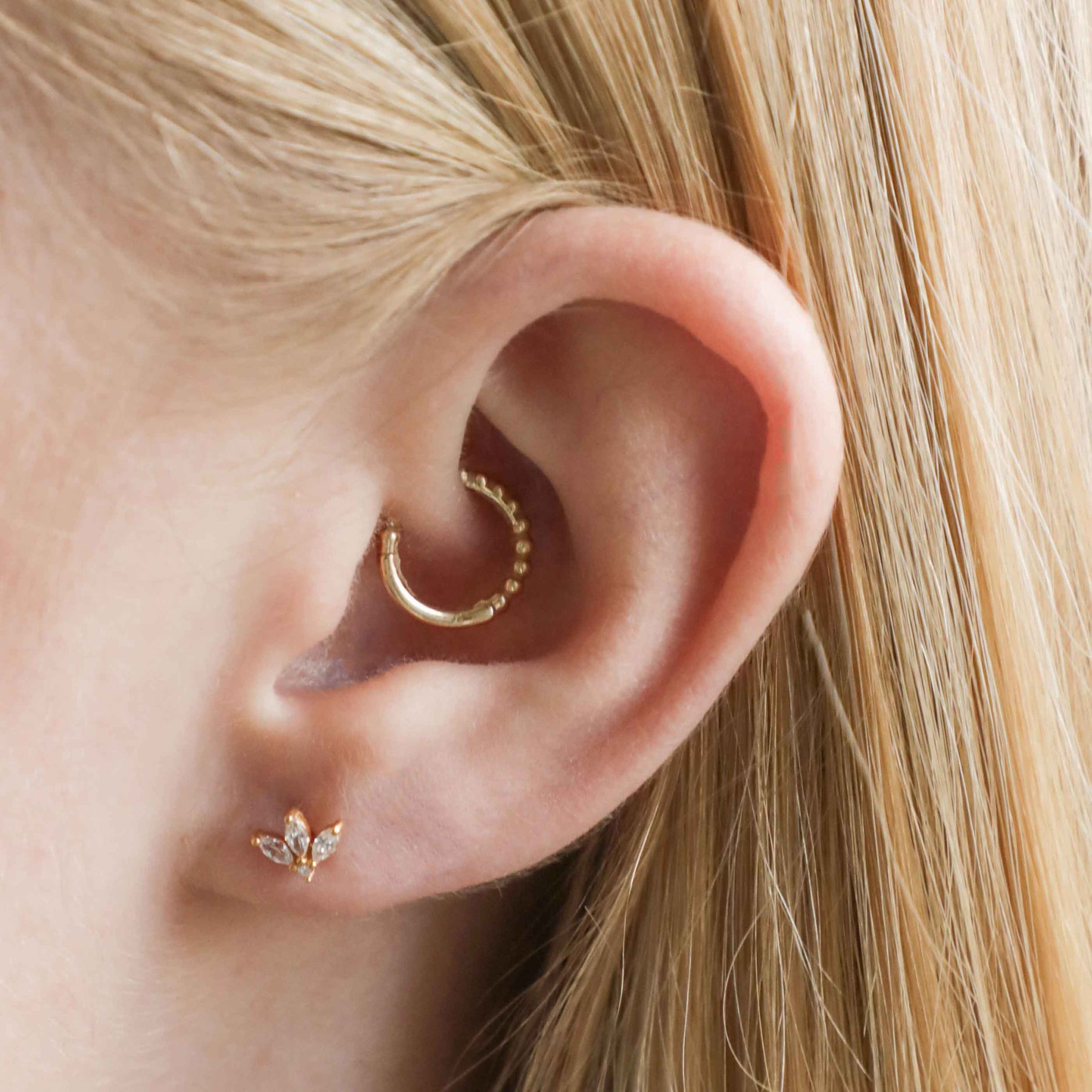 Navette Fan Barbell in Gold worn in lobe piercing