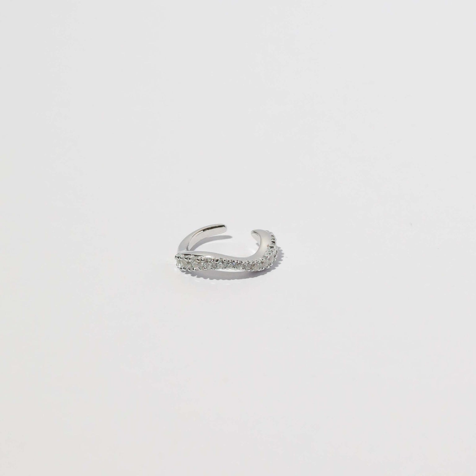 Wave Crystal Ear Cuff in Silver flat lay