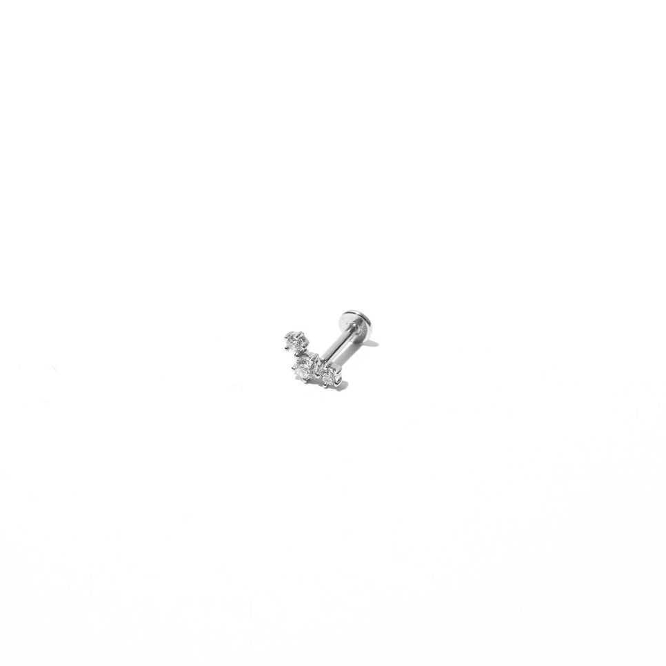 Curved Crystal Piercing Stud in Solid White Gold flat lay shot