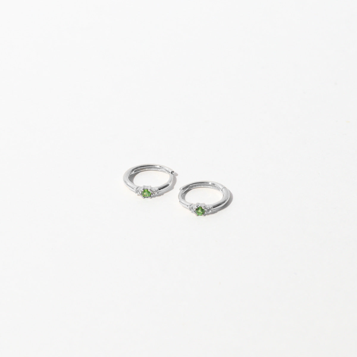 Tsavorite Hoops in Solid White Gold flat lay
