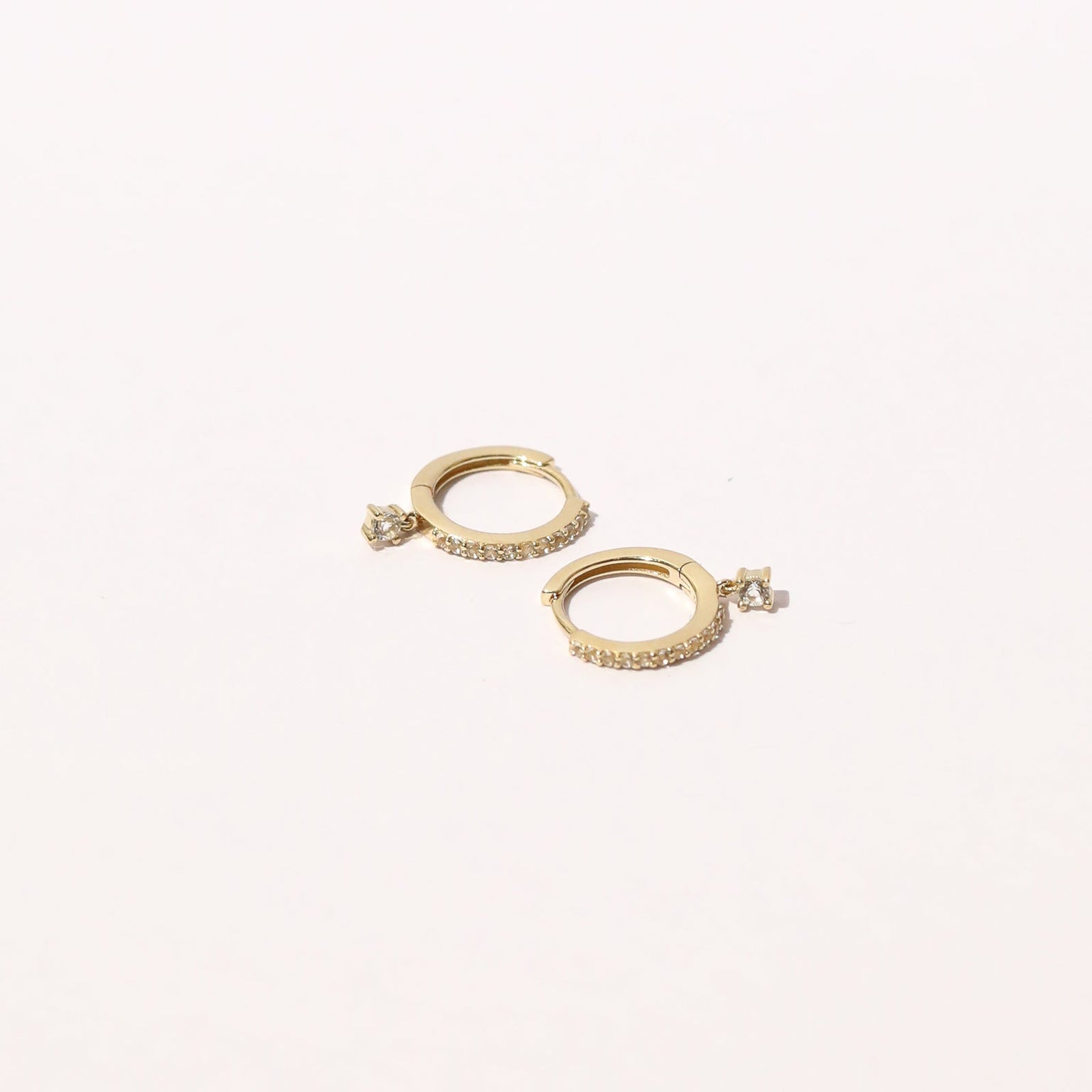 Topaz Charm Hoops in Solid Gold flat lay