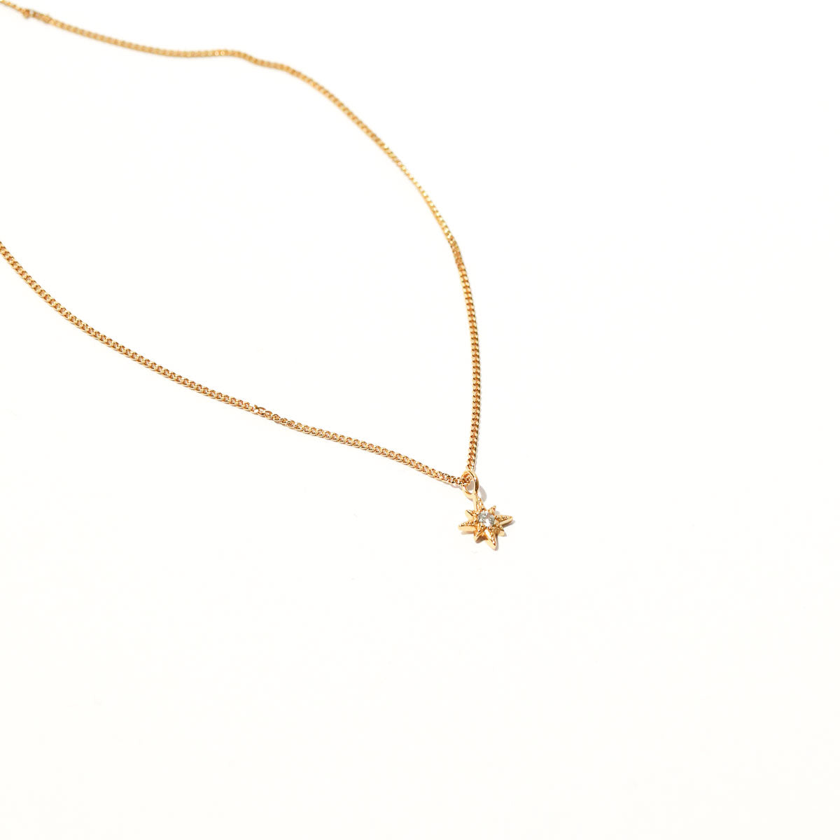 Twilight Star Pendant Necklace in Gold flat lay