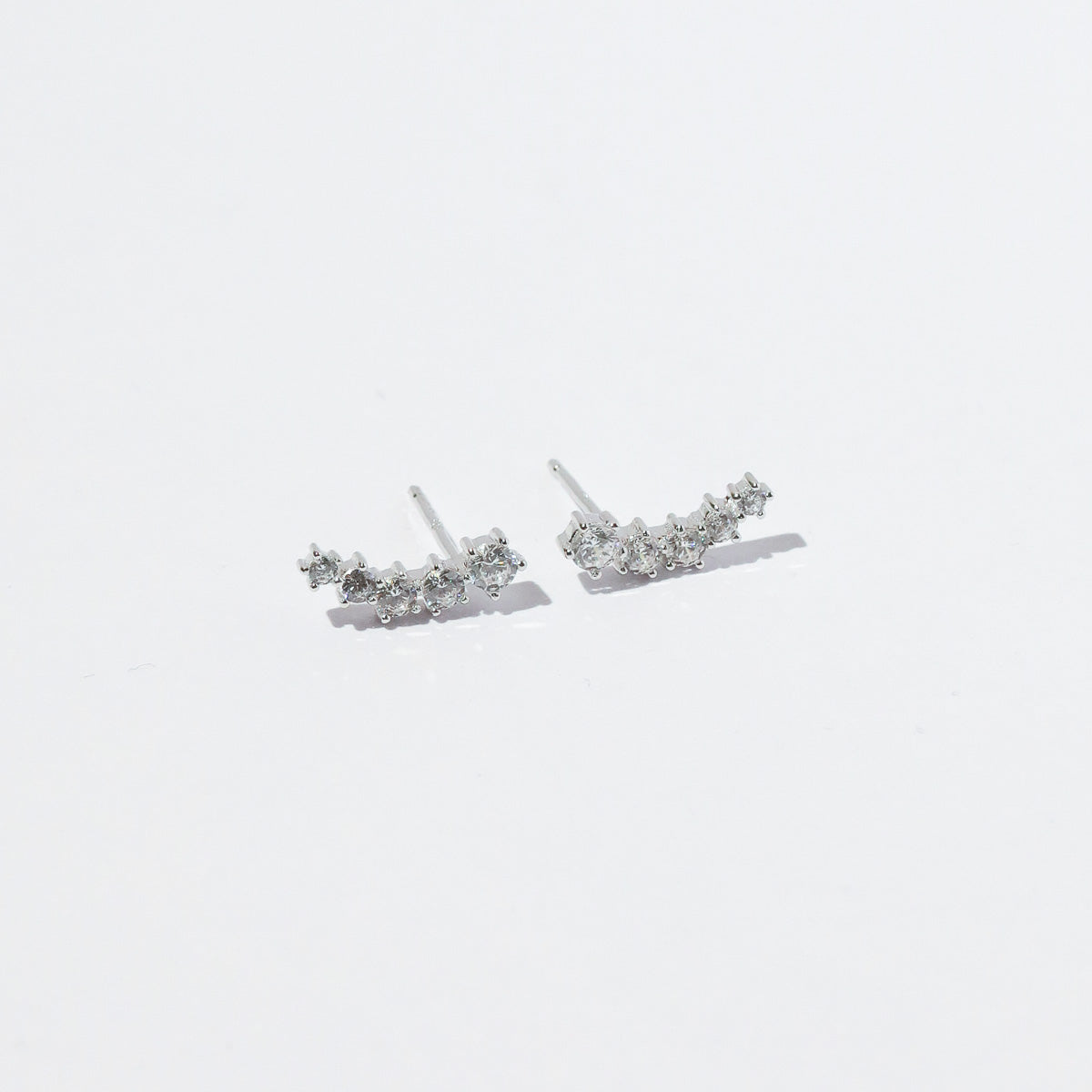 Illume Crystal Climber Stud Earrings in Silver flat lay