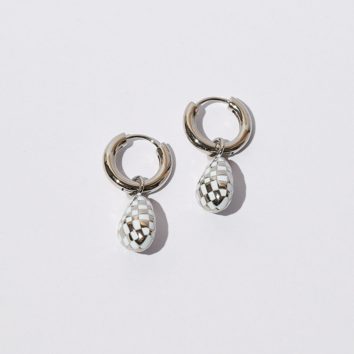 Checkerboard Pendant Hoops in Silver flat lay