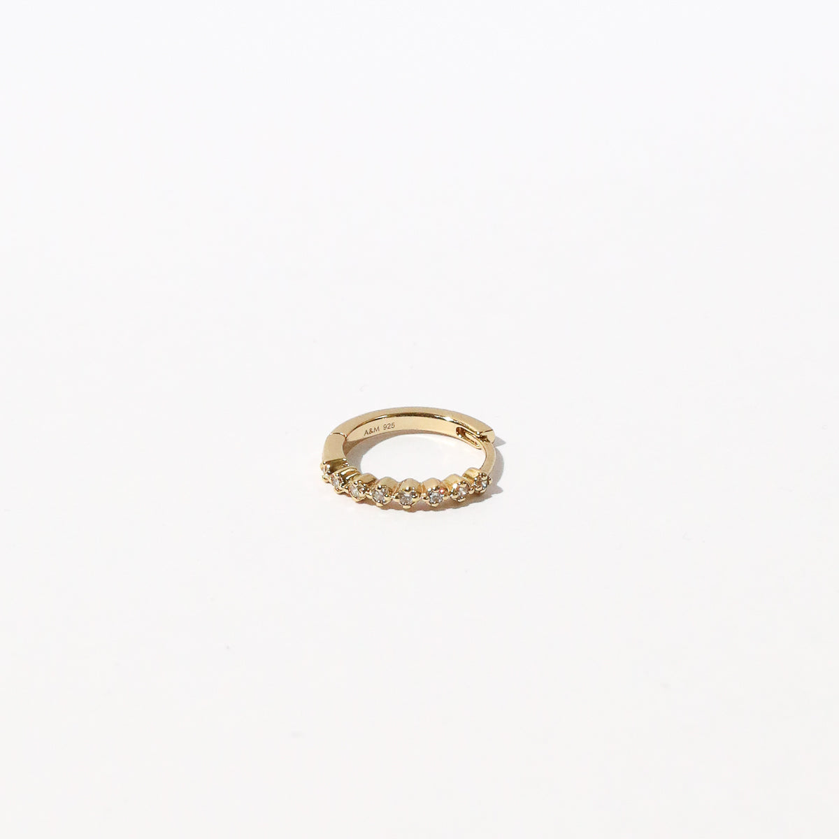 Illume Crystal 11.5mm Hoop in Gold flat lay shot