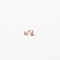Cosmic Star Crystal Stud Earrings in Rose Gold flat lay
