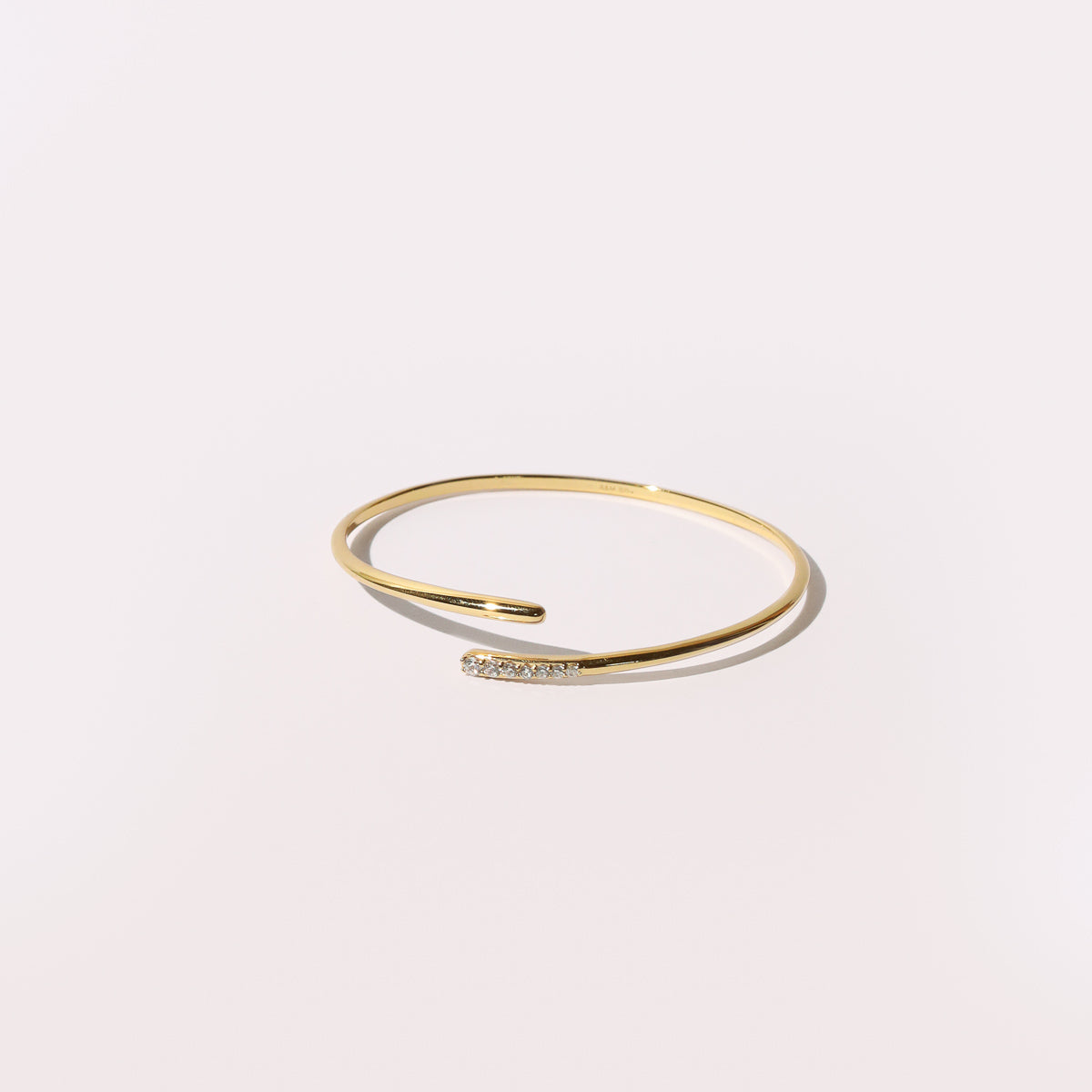 Orbit Crystal Cuff in Gold flat lay shot