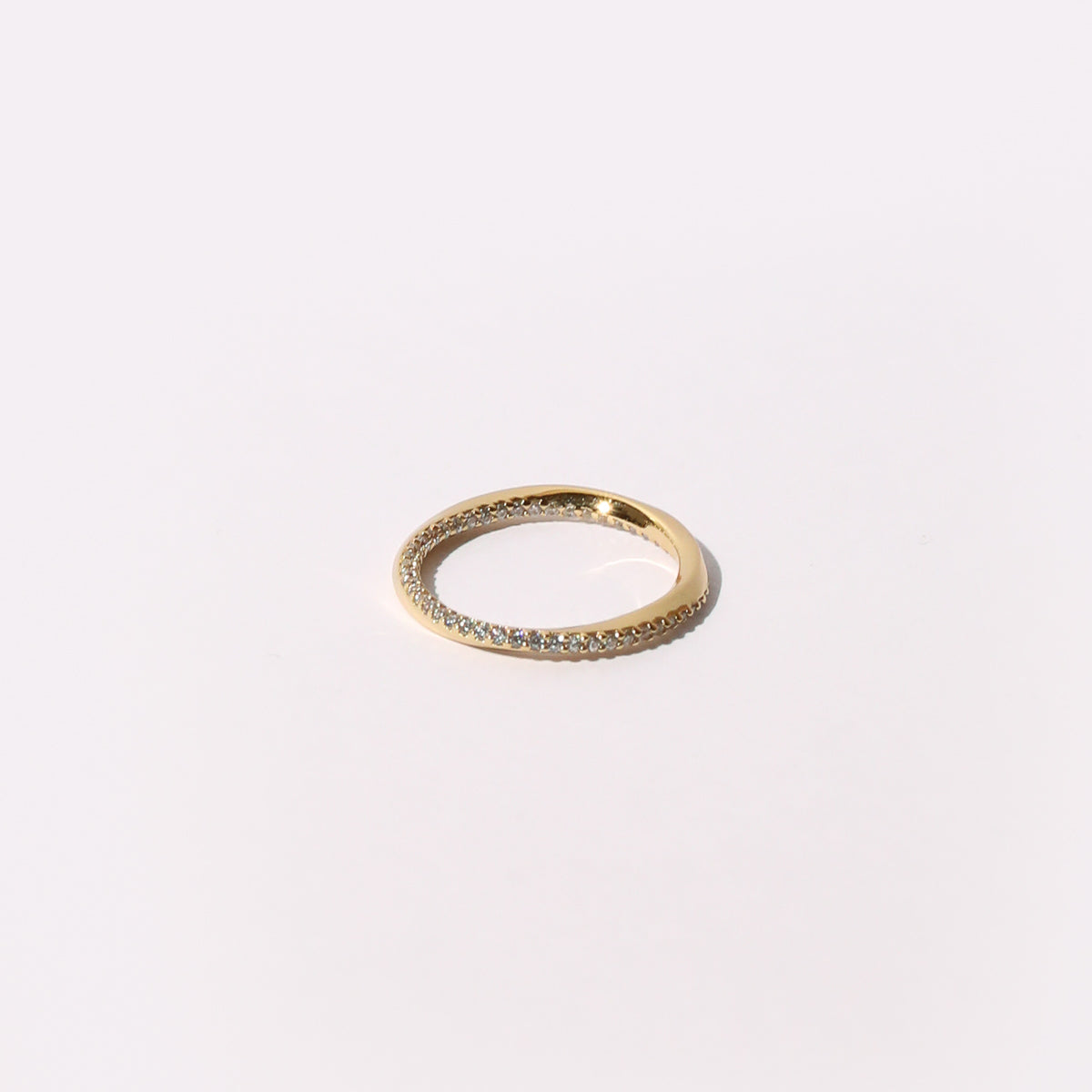 Orbit Crystal Band Ring in Gold flat lay