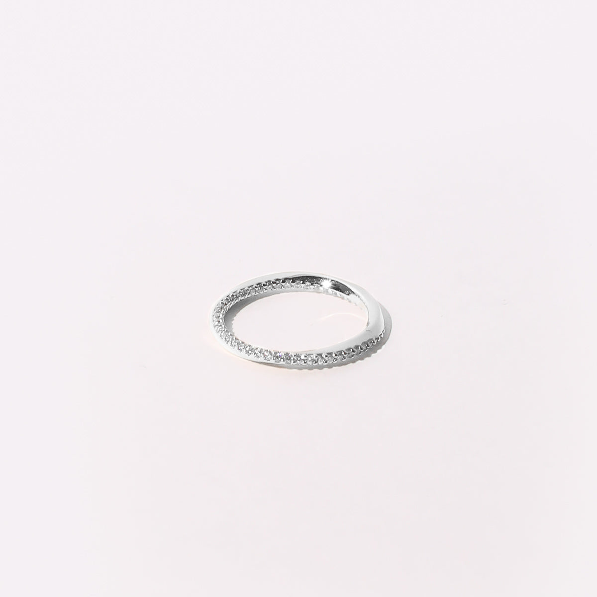 Orbit Crystal Band Ring in Silver Flat Lay
