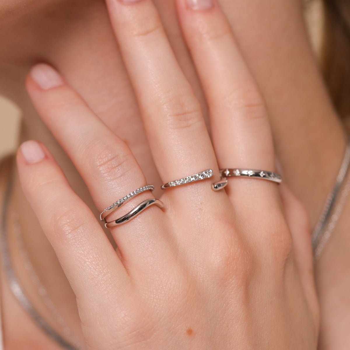 Orbit Crystal Ring in Silver worn with other rings