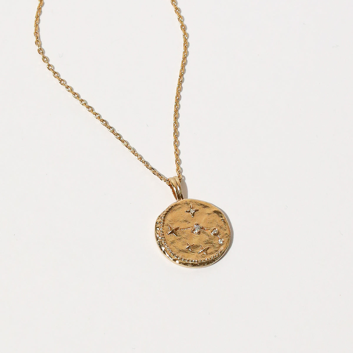Close up shot of the front of the Aries Zodiac Pendant Necklace in Gold