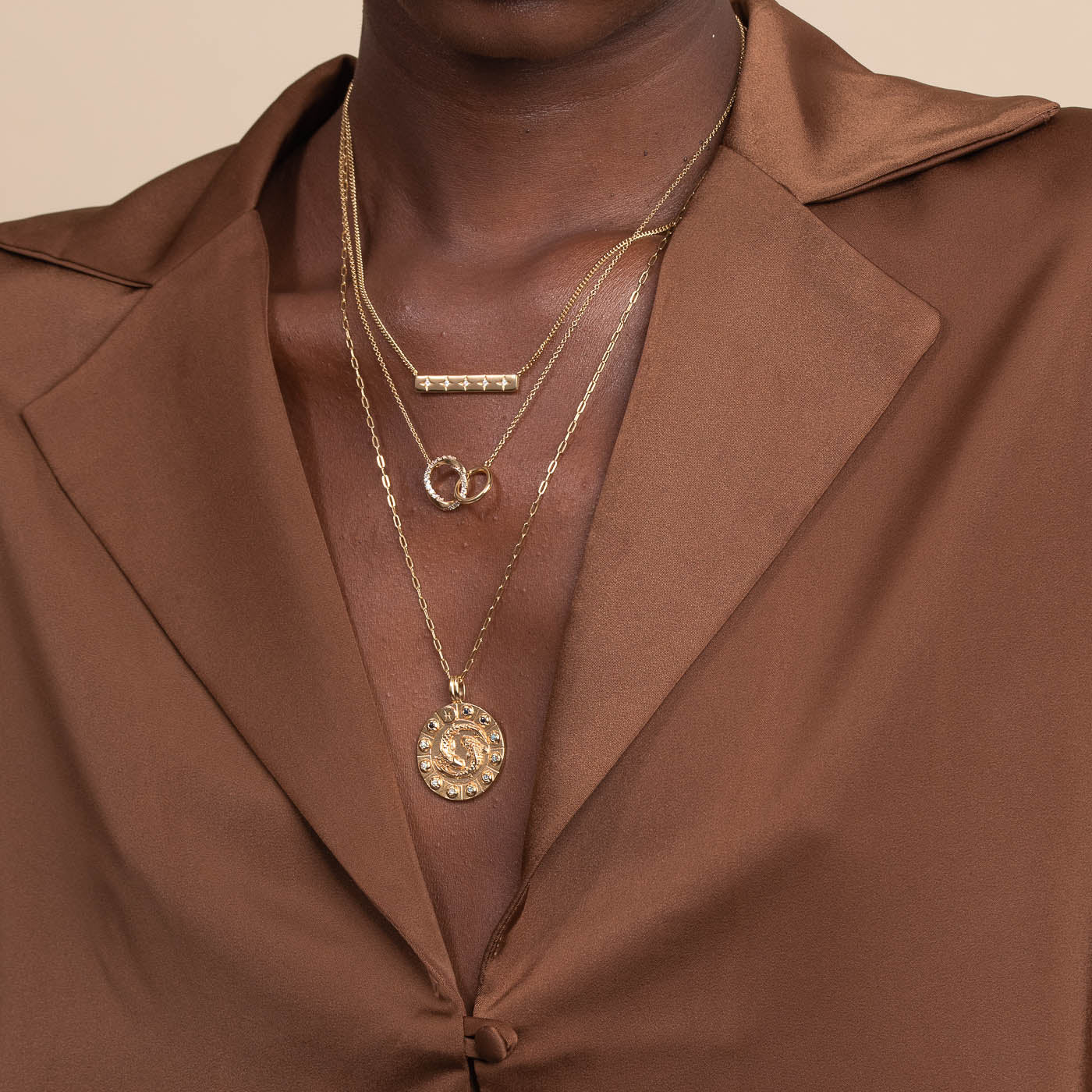 Pisces Bold Zodiac Pendant Necklace in Gold worn layered with necklaces
