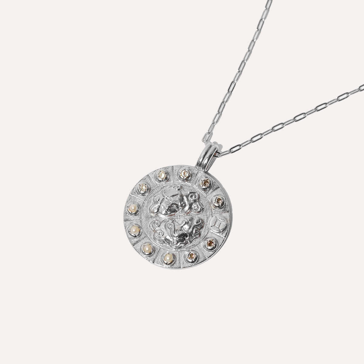 Gemini Bold Zodiac Pendant Necklace in Silver flat lay