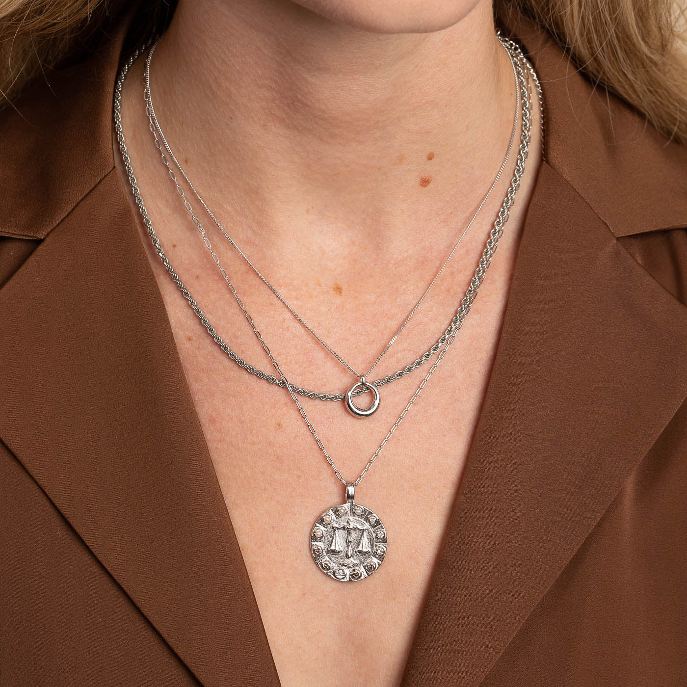 Libra Bold Zodiac Pendant Necklace in Silver worn layered with necklaces
