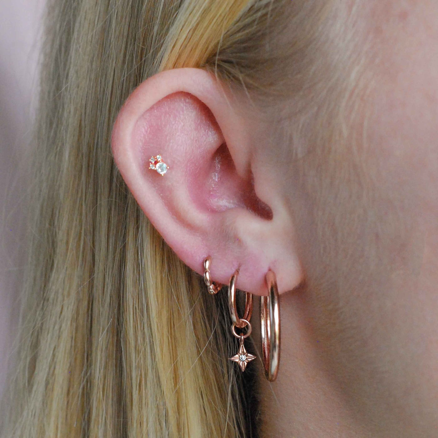 Bubble Clicker in Rose Gold worn in third lobe piercing