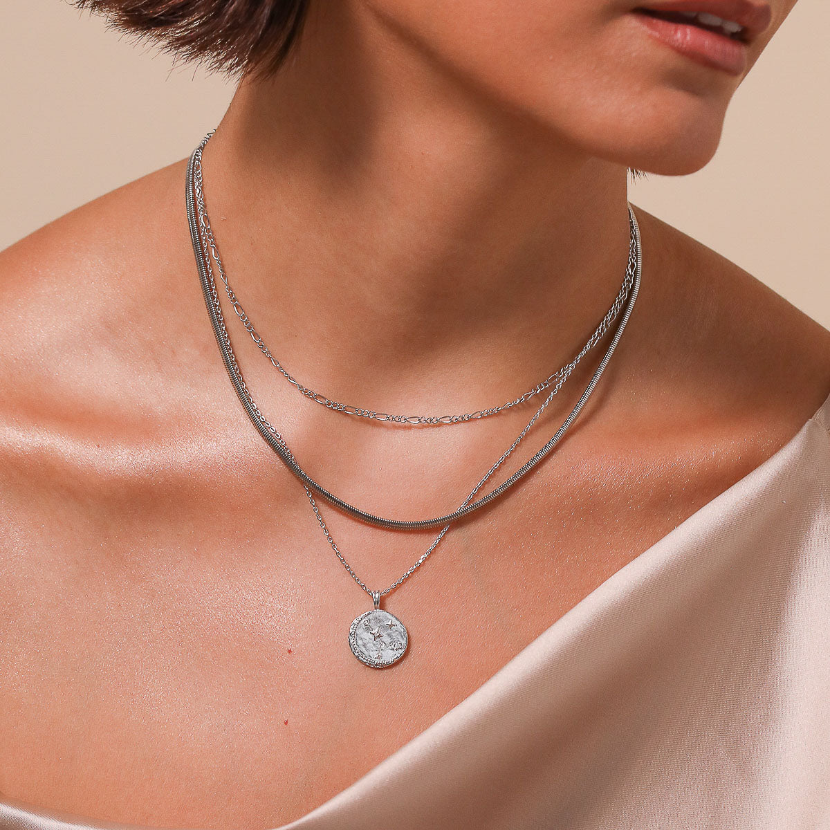 Cancer Zodiac Pendant Necklace in Silver worn layered with necklaces