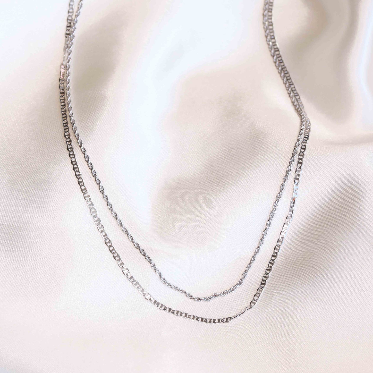 Flat lay shot of Duo Chain Necklace in Silver