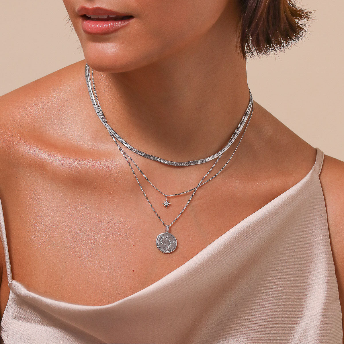 Gemini Zodiac Pendant Necklace in Silver worn layered with necklaces