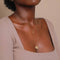 E Initial Pendant Necklace in Gold worn with Zodiac pendant necklace