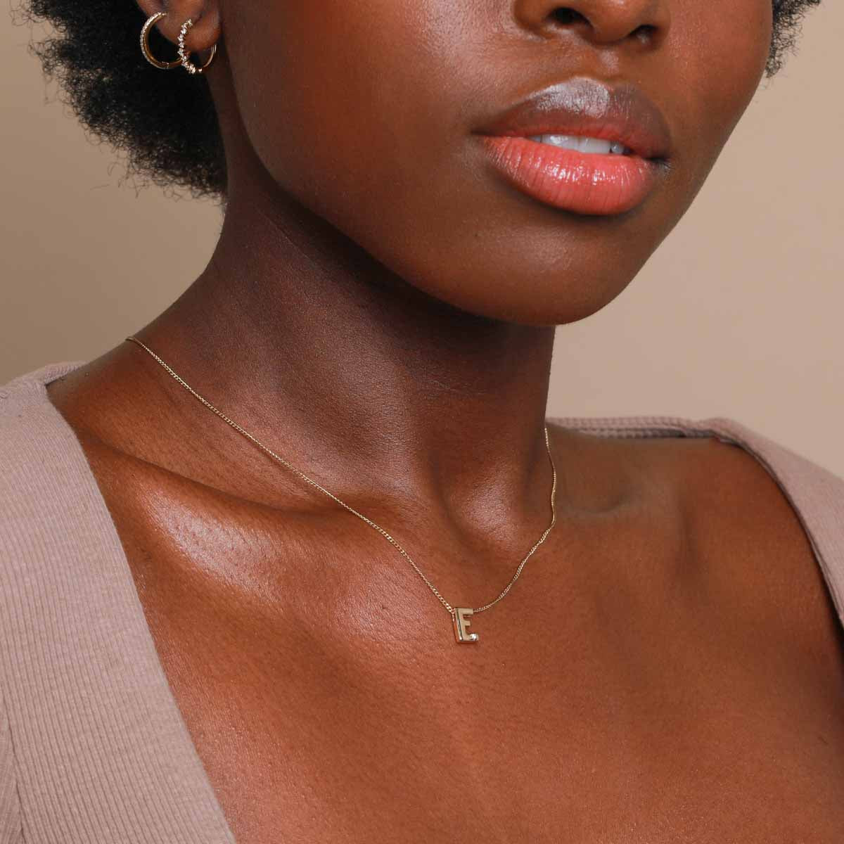 E Initial Pendant Necklace in Gold worn