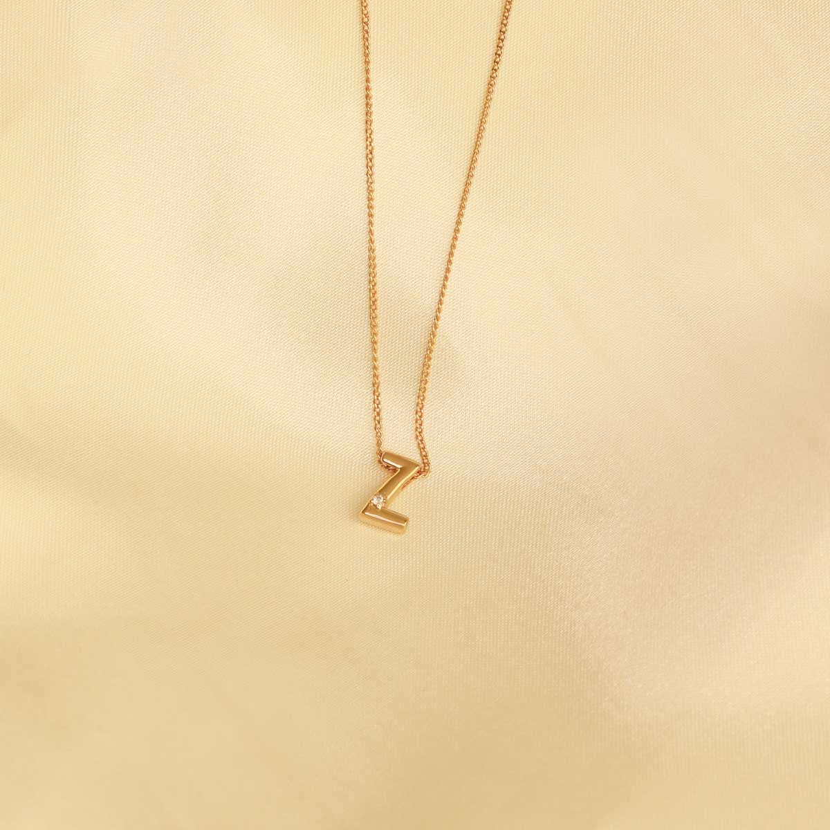 Flat lay shot of Z Initial Pendant Necklace in Gold