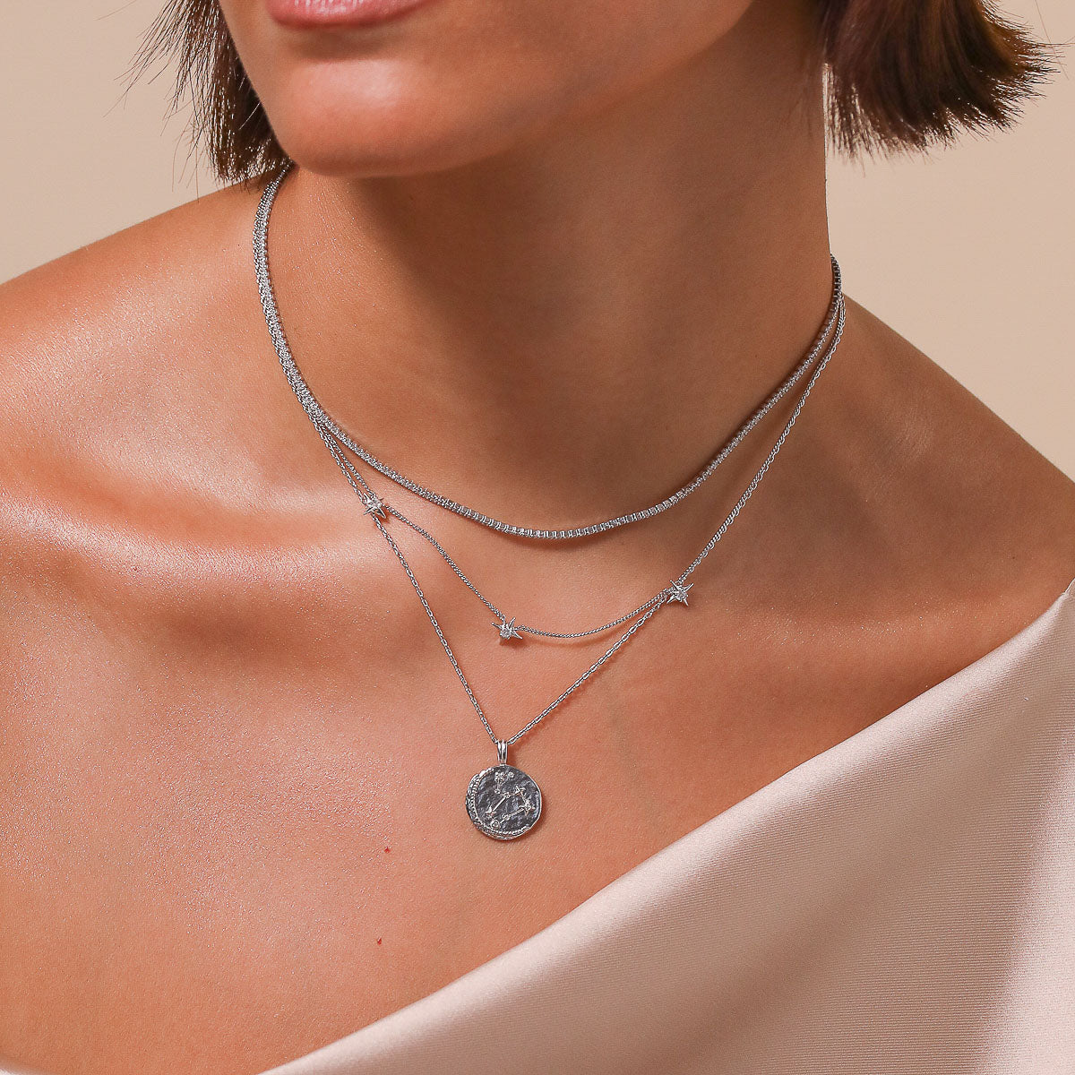 Leo Zodiac Pendant Necklace in Silver worn layered with necklaces