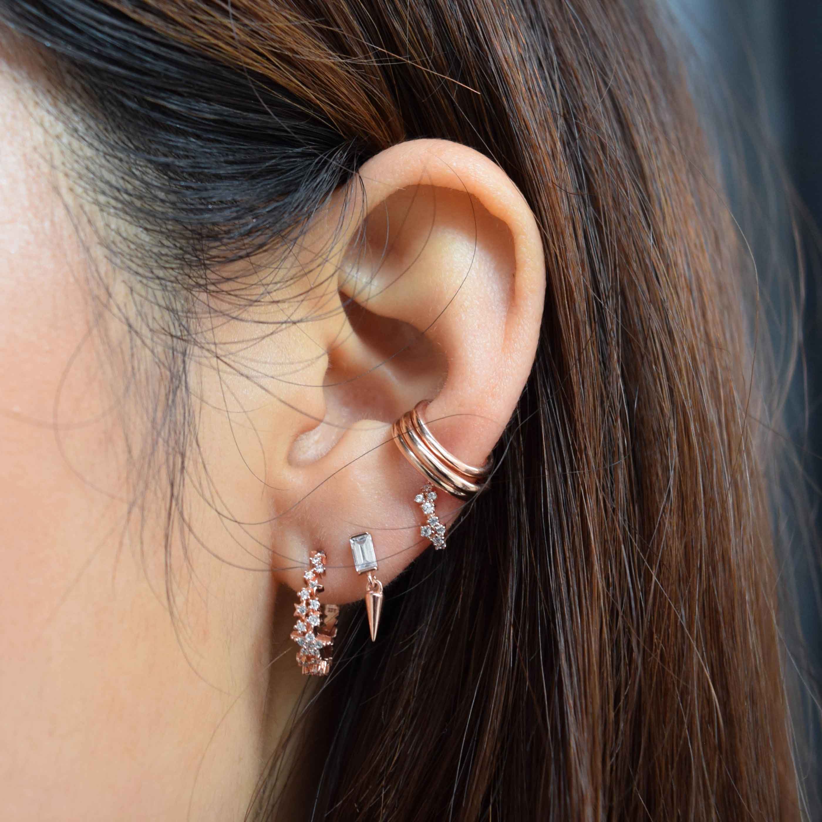 Mystic Gem Huggies in Rose Gold worn with rose gold earrings