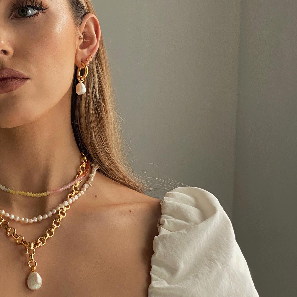 Serenity Pearl Charm Hoops in Gold worn by Olivia Burton