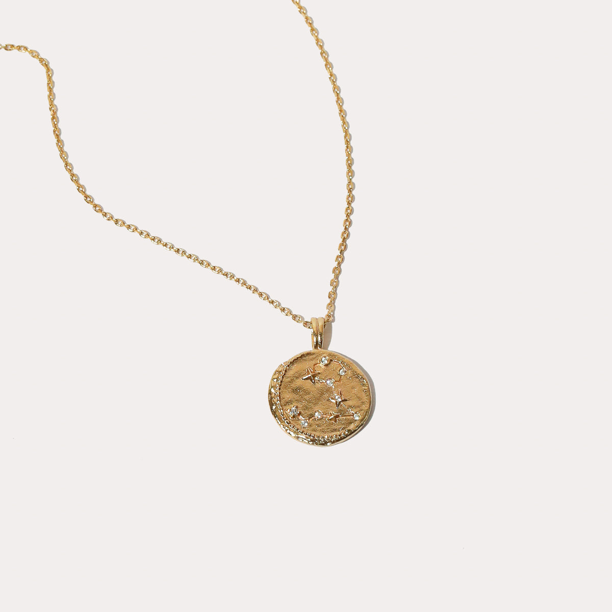 Close up shot of the front of the Pisces Zodiac Pendant Necklace in Gold