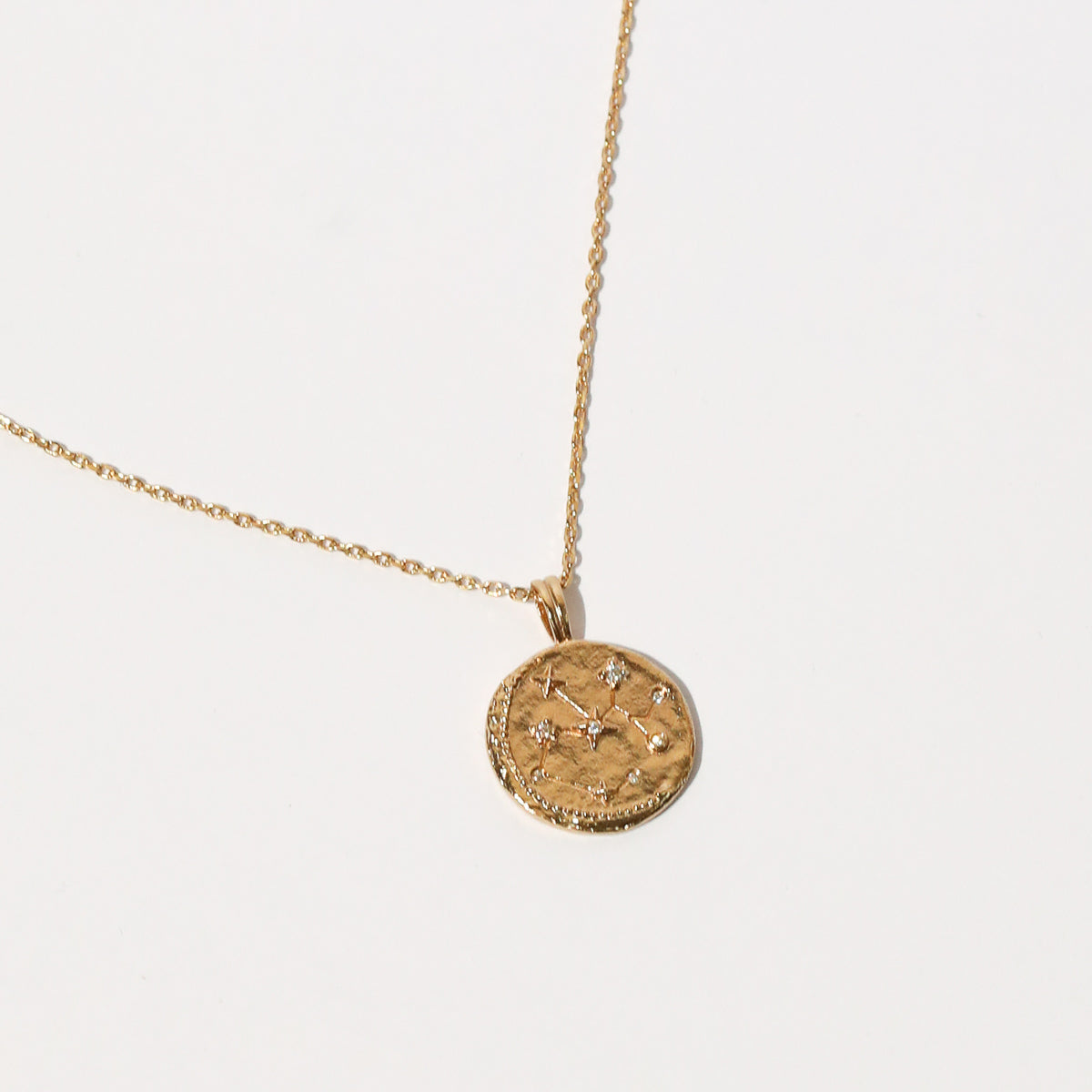 Close up shot of the front of the Sagittarius Zodiac Pendant Necklace in Gold