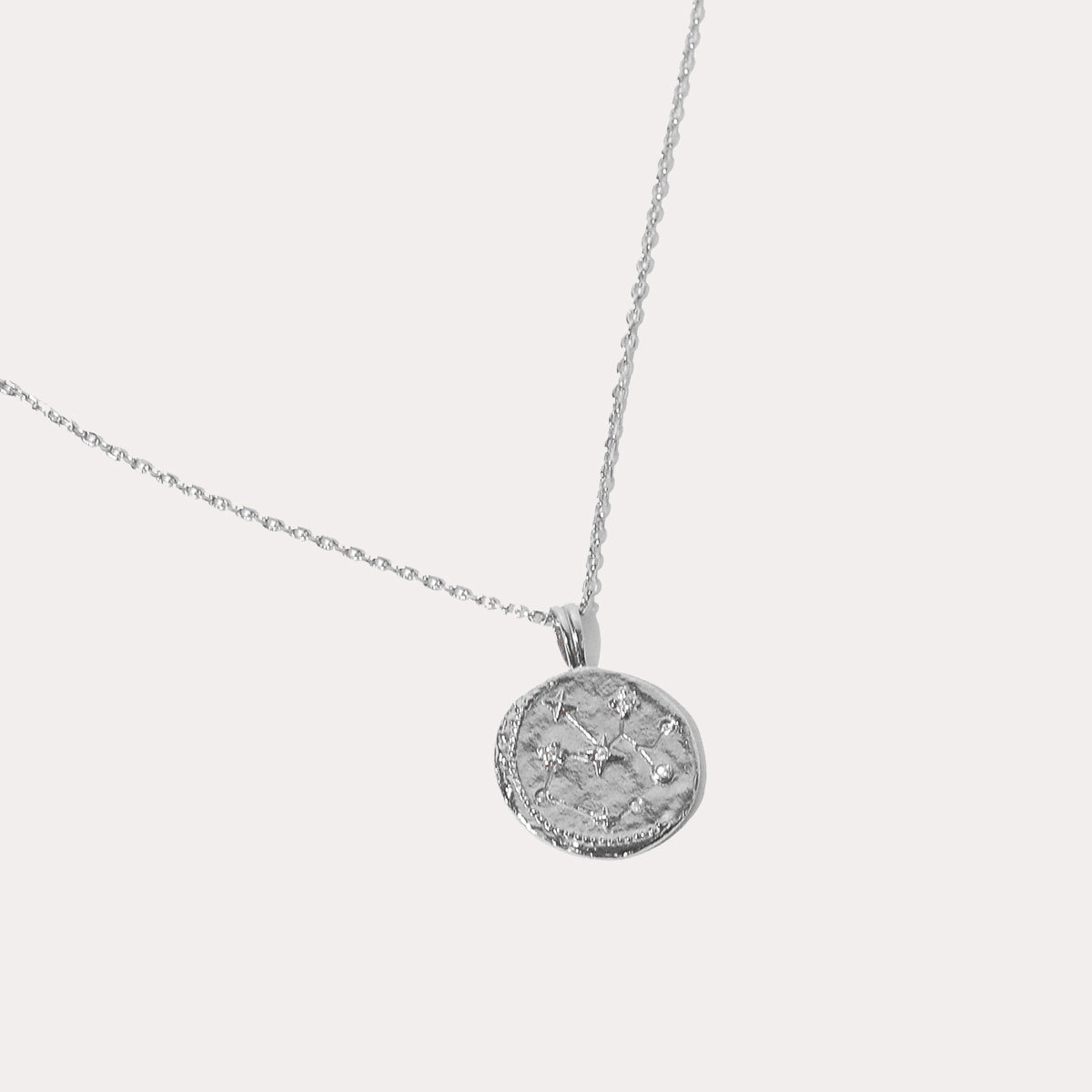 Close up shot of the front of the Sagittarius Zodiac Pendant Necklace in Silver