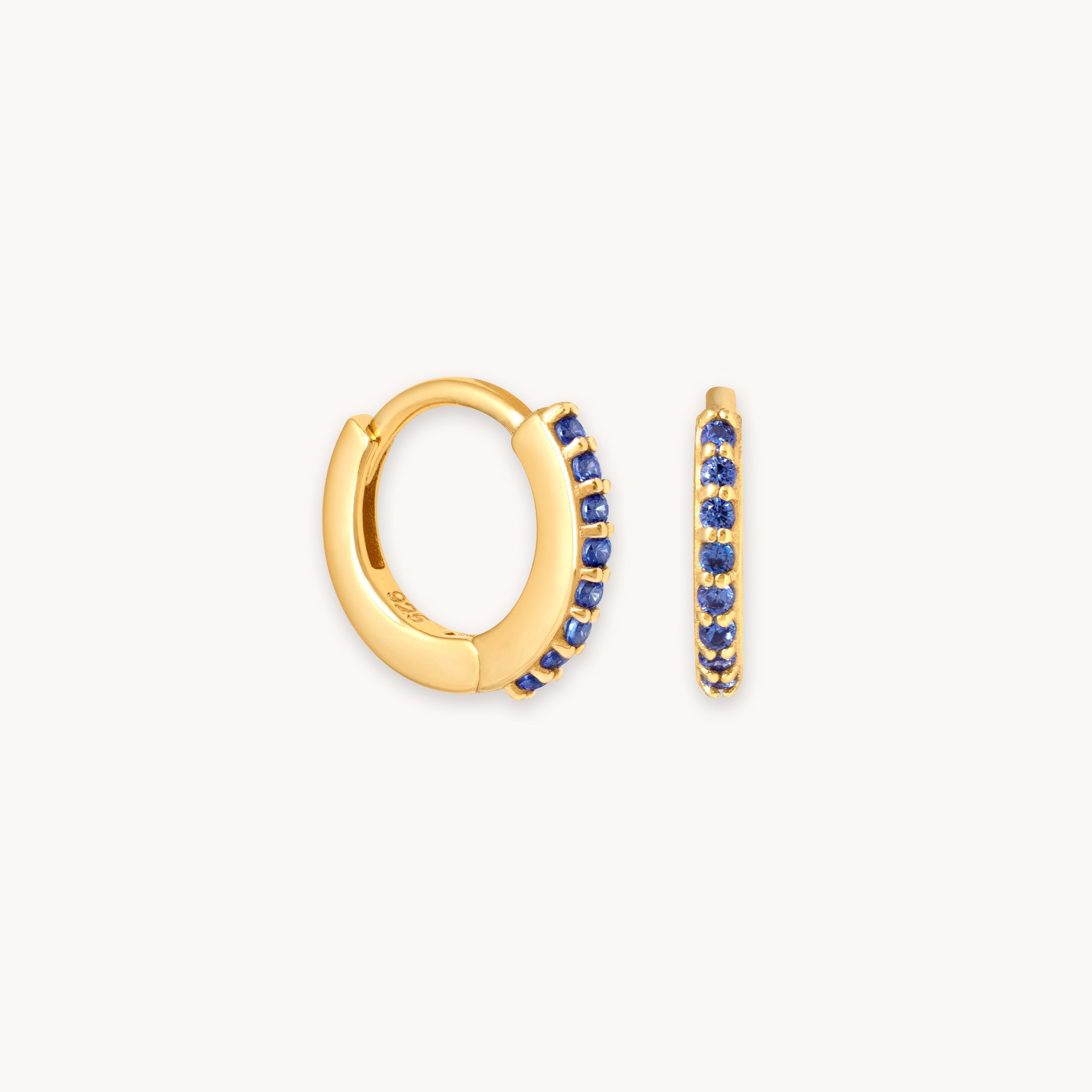 September Birthstone Huggies in Gold with Sapphire CZ