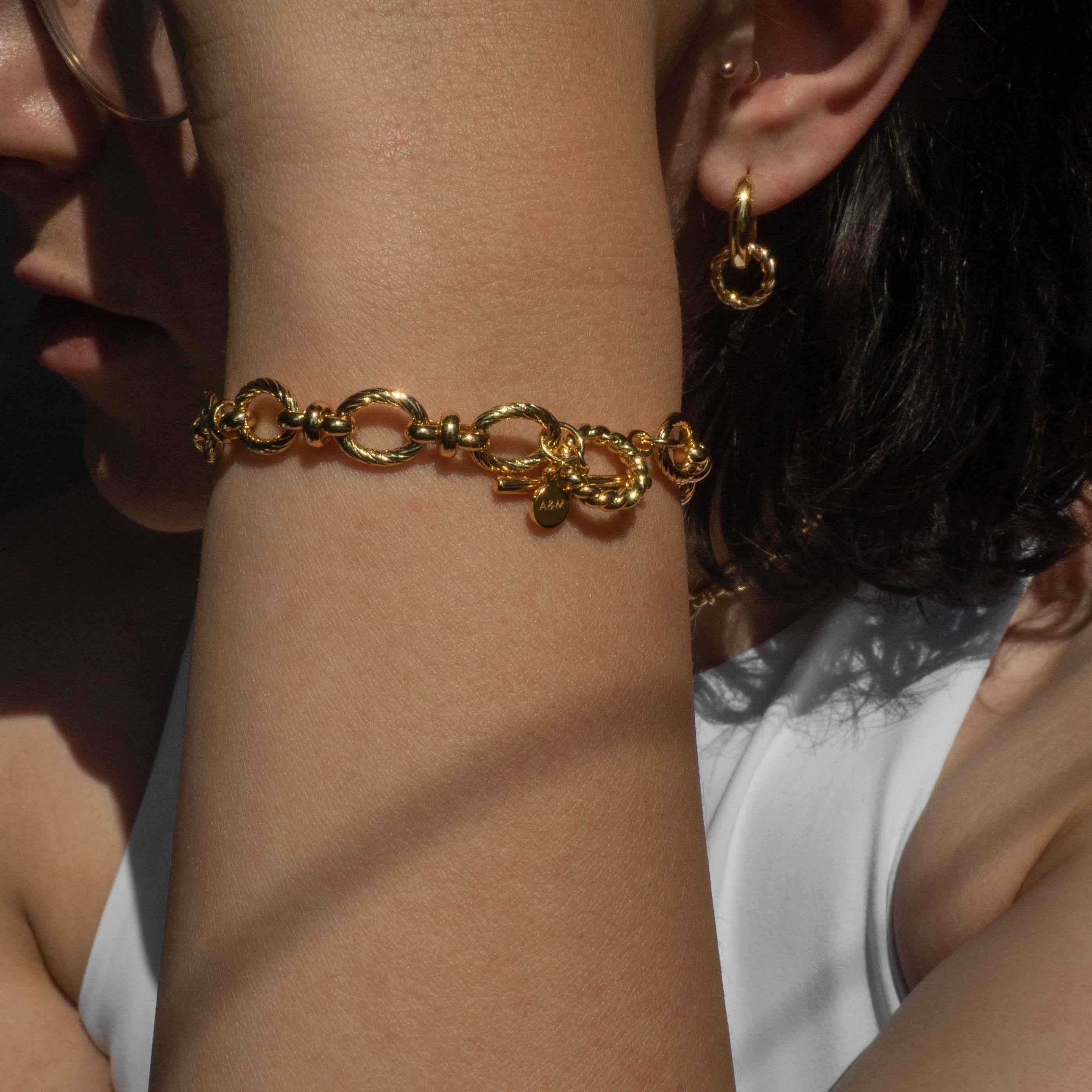 Textured Oval Link T-Bar Bracelet in Gold worn