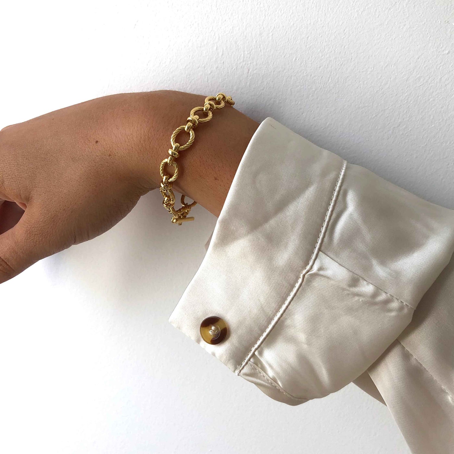 Textured Oval Link T-Bar Bracelet in Gold worn