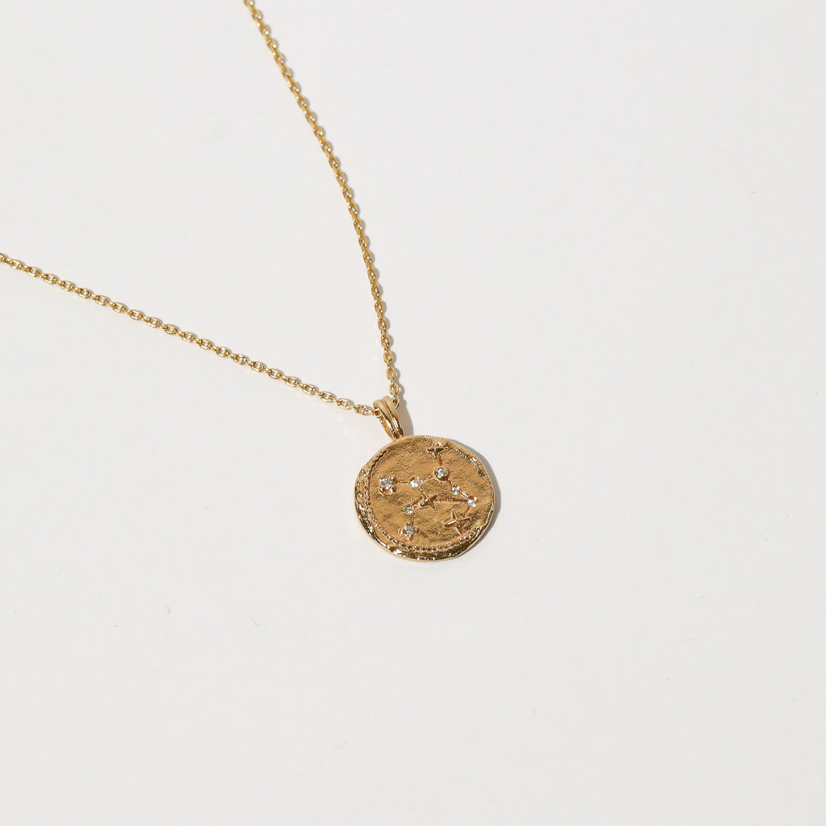 Close up shot of the front of the Virgo Zodiac Pendant Necklace in Gold