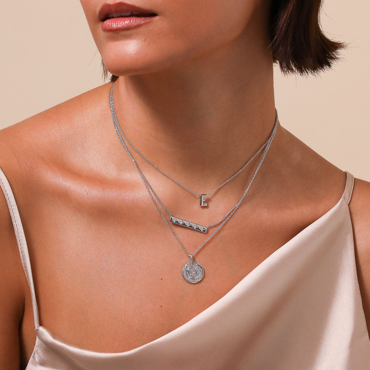 Virgo Zodiac Pendant Necklace in Silver worn layered with necklaces