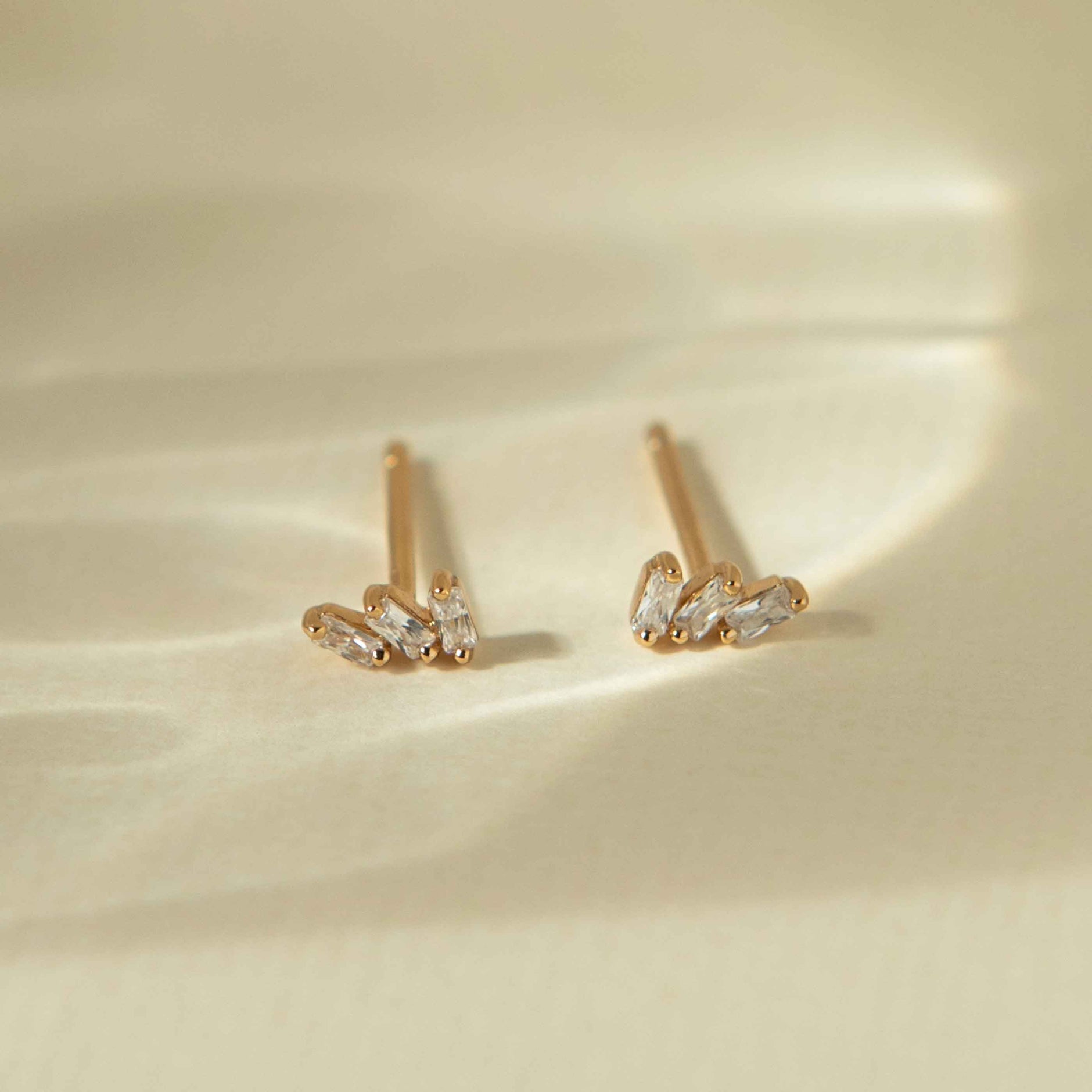 Baguette Crystal Stud Earrings in Gold flat lay shot