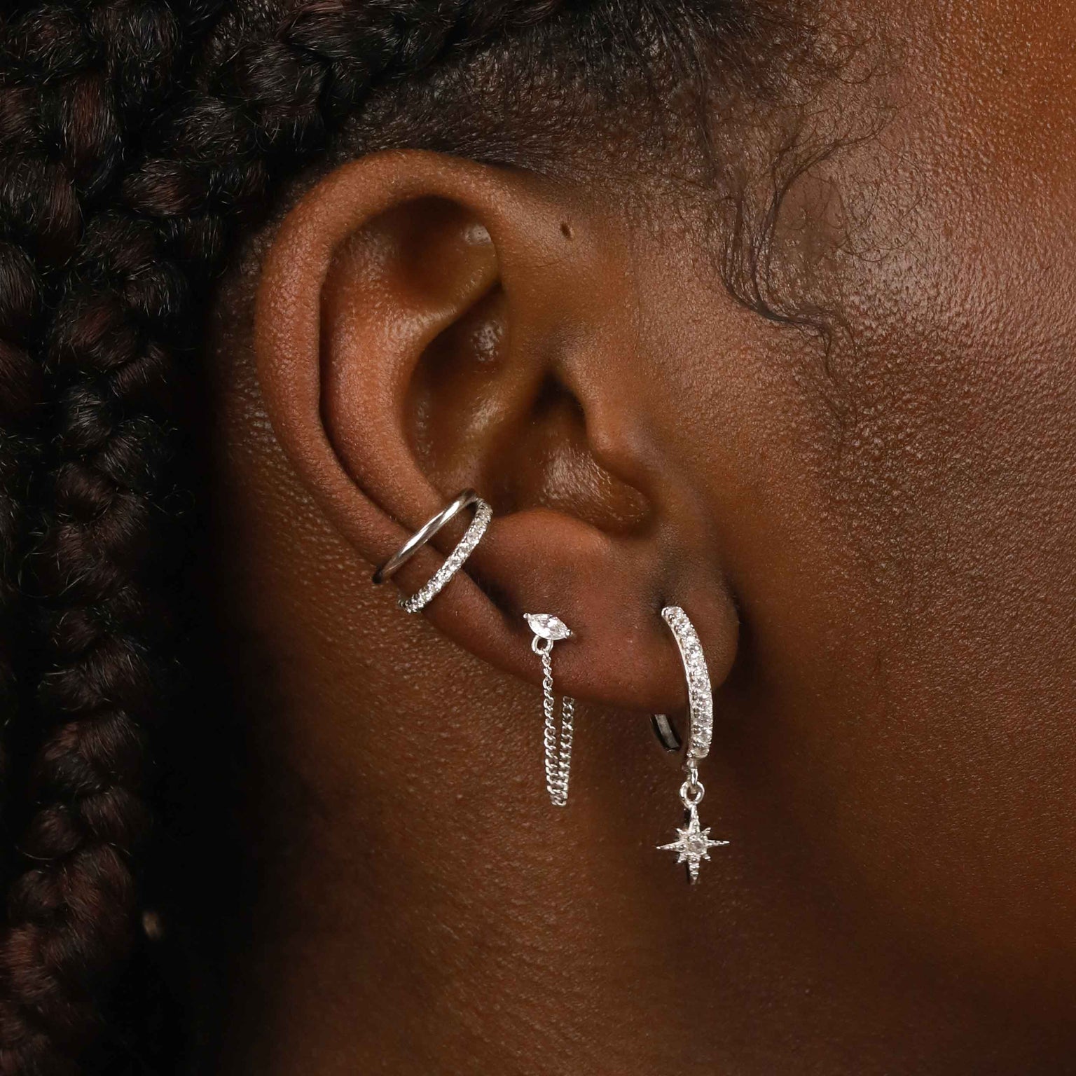 Crystal Star Hoops in Silver worn with other earrings